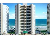 Beautiful high-rise beachfront condo building with ocean views and manicured landscaping at 3315 S Atlantic Ave # 1106, Daytona Beach, FL 32118