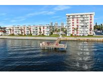 Waterfront condominium complex featuring a private pier and stunning water views at 2711 N Halifax Ave # 890, Daytona Beach, FL 32118
