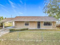 Charming single-story home with a front yard and attached carport providing convenient parking at 3009 Bond St, Deltona, FL 32738