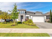 Beautiful single Gathering home with manicured lawn and a two car garage at 6271 W Fallsgrove Ln, Port Orange, FL 32128