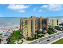 Stunning beachfront condo with pool, palm trees, and ocean views at 1925 S Atlantic Ave # 201, Daytona Beach, FL 32118