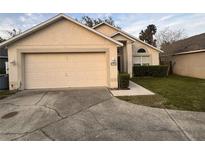 Charming single-Gathering home with a well-manicured lawn and two car garage at 802 Delfino Pl, Lake Mary, FL 32746