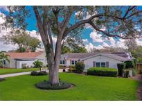 Charming single Gathering home with a beautiful landscaped yard with mature trees in a sunny neighborhood at 901 Ponca Trl, Maitland, FL 32751