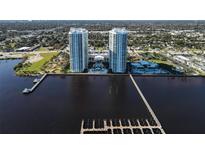 Stunning aerial view of luxury high-rise condos with boat docks on the waterway at 231 Riverside Dr # 1801-1, Daytona Beach, FL 32117