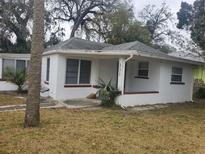 Charming single-story home featuring a white brick exterior and quaint front porch at 333 8Th St, Daytona Beach, FL 32117