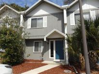 Charming townhome featuring a blue front door, gray siding and white trim at 3960 Willow Trail Run # 45, Port Orange, FL 32127