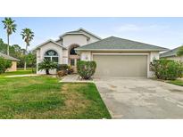 Charming single-Gathering home with mature landscaping and a two-car garage at 6408 Whit Ct, Port Orange, FL 32128