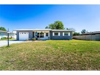 Charming single story home with a well-maintained front yard and a single car garage at 1199 Galgano Ave, Deltona, FL 32725