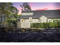 Charming home with a well-manicured lawn and a cozy, gated front porch entrance at 1465 Farrindon Cir # 1465, Lake Mary, FL 32746