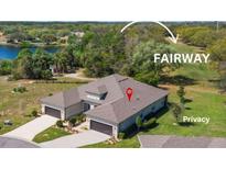 Stunning aerial view of home with a well-manicured lawn, backing onto the lush green fairway of the golf course at 3329 Bailey Ann Dr, Ormond Beach, FL 32174