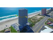 Oceanfront condo building features a modern design with stunning views of the beach and coastline at 2200 N Atlantic Ave # 1201, Daytona Beach, FL 32118