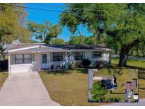 Charming one-story home featuring a well-maintained lawn, complementing the property's inviting curb appeal at 501 Powers Ave, Port Orange, FL 32127