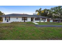 Ranch style home with a well manicured front yard at 1560 S Pearl St, Deland, FL 32720