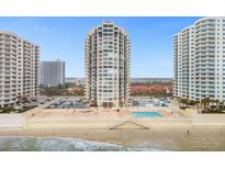 Stunning oceanfront condominium building with private beach access and a beautiful outdoor pool and lounge area at 2947 S Atlantic Ave # 201, Daytona Beach Shores, FL 32118