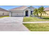 Charming single-story home with a well-maintained lawn and beautiful landscaping, offering great curb appeal at 5298 Bear Corn Run, Port Orange, FL 32128