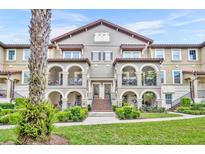Beautiful multi-Gathering home with arched entryway, lush landscaping, and a red tile roof at 1436 Lobelia Dr, Lake Mary, FL 32746