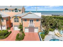 Beachside multi-story home boasting ocean views and a brick driveway at 3000 Ocean Shore Blvd # 6, Ormond Beach, FL 32176