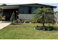 Well maintained home with manicured lawn and landscaping at 130 Oak Tree Dr, Debary, FL 32713