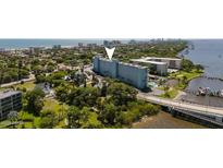Stunning aerial view of the building with beach access, boat docks, and waterfront views at 100 Silver Beach Ave # 716, Daytona Beach, FL 32118