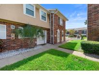 Charming two-story brick home with well-manicured landscaping and a welcoming walkway at 2200 S Palmetto Ave # B060, Daytona Beach, FL 32119