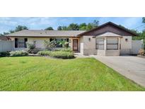 Inviting home featuring a well-maintained lawn and nicely landscaped front yard at 257 Deleon Rd, Debary, FL 32713