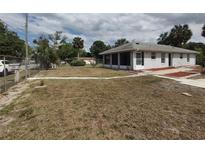 Charming home featuring a well-maintained lawn, inviting walkway, and freshly painted exterior at 540 W Mathis Ave, Deland, FL 32720