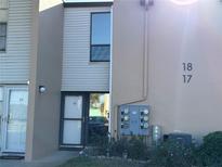 Condominium exterior featuring a well-maintained facade, and inviting entrance at 5500 Ocean Shore Blvd # Ut18, Ormond Beach, FL 32176