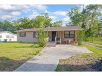 Charming single-story home featuring a classic design with a well-maintained front yard at 816 W Franklin Ave, Deland, FL 32720