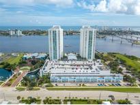 An aerial view of a modern condo building with waterfront views and convenient parking at 241 Riverside Dr # 2110, Daytona Beach, FL 32117