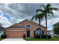 Charming single Gathering home featuring an attached garage, and well-maintained landscaping at 320 Conch Key Way, Sanford, FL 32771