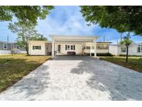 Charming single-story home with a covered carport and a well-maintained front yard at 44 Florence Blvd, Debary, FL 32713