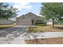 Charming single-story home with a well-maintained lawn and mature landscaping, offering great curb appeal at 811 Grand Park Ct, Deland, FL 32724