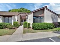 Charming condo featuring well-maintained landscaping and a welcoming entryway at 101 Grand Plaza Dr # A30, Orange City, FL 32763
