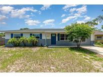 Charming single-story home with blue shutters and a well-maintained front yard, perfect for curb appeal at 1808 Green Pl, Ormond Beach, FL 32174