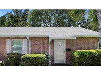 Charming brick home featuring a well-maintained front entrance and established landscaping at 3 Fairway Ct, Deland, FL 32724