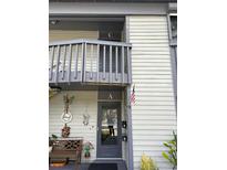 Charming condo entrance features a decorated entryway, neutral paint, and easy access at 600 N Boundary Ave # 114-C, Deland, FL 32720