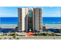 Oceanfront condo building with private balconies offering stunning views of the beach and Atlantic Ocean at 2967 S Atlantic Ave # 1404, Daytona Beach, FL 32118