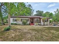Charming single-story home featuring a landscaped yard, fresh paint, and a welcoming front entrance at 601 N Garfield Ave, Deland, FL 32724