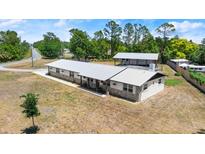 Charming single story home featuring a metal roof and decorative stone accents at 793 Timothy St, Ormond Beach, FL 32174