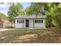 Charming single-story home with a well-maintained lawn and classic architectural details, creating a welcoming curb appeal at 706 W Franklin Ave, Deland, FL 32720