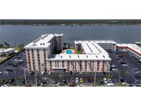 An aerial view of the condo complex showcasing the private pool and ample parking at 2711 N Halifax Ave # 496, Daytona Beach, FL 32118