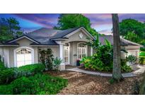 Charming single-story home with beautiful landscaping and a welcoming front entrance at 397 Quail Hill Dr, Debary, FL 32713
