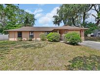 Charming single-story home with well-maintained landscaping in a quiet residential neighborhood at 416 N Blue Lake Ter, Deland, FL 32724