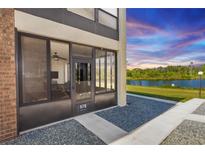 Enclosed sunroom offers scenic lake views, expanding living space and bringing the outdoors in at 576 Belltower Ave # 100, Deltona, FL 32725