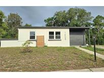 Charming single-story home featuring a modern design and freshly painted exterior at 1408 W Wellington Dr, Deltona, FL 32725