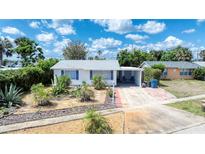 Charming home featuring a xeriscaped front yard and a convenient carport, blending curb appeal with practical design at 31 River Shore Dr, Ormond Beach, FL 32176