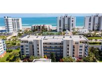 Coastal condominiums featuring lush landscaping and ocean views, perfect for beach living at 5300 S Atlantic Ave # 12-403, New Smyrna Beach, FL 32169