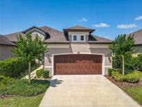 Charming home featuring a two-car garage, landscaped front yard, and a concrete driveway at 3148 Bailey Ann Dr, Ormond Beach, FL 32174