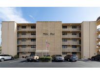 Exterior view of Wilder Blvd Condominiums featuring a multi-story building with balconies and ample parking at 325 Wilder Blvd # A102, Daytona Beach, FL 32114