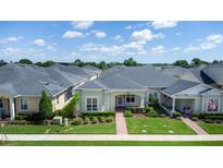 Charming single-story home featuring manicured landscaping and a welcoming brick pathway to the front door at 3402 Torre Blvd, New Smyrna Beach, FL 32168